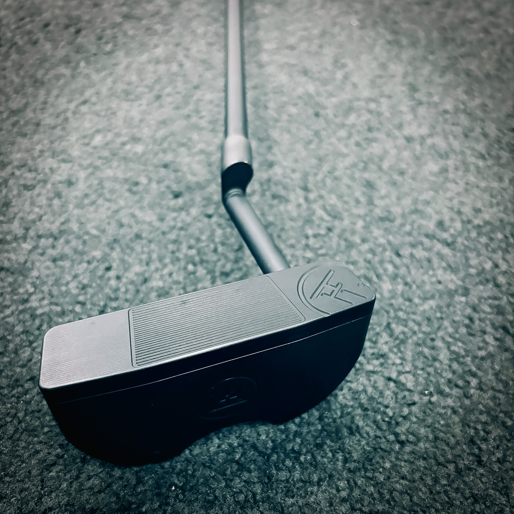 Fine-Tuned Putter at address with laser